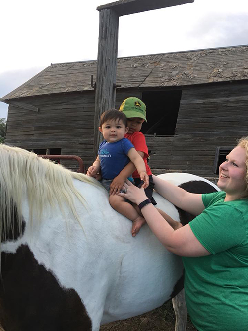 Little cowboys on horseback