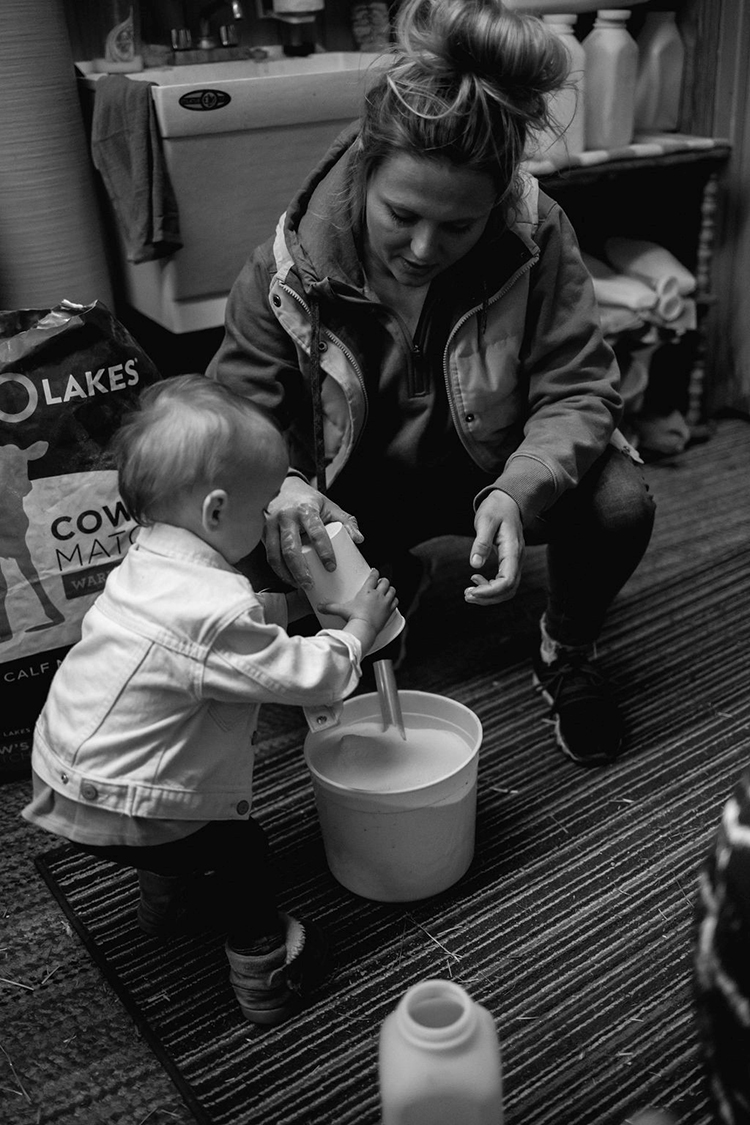 Chelsey and her daughter at work on the farm