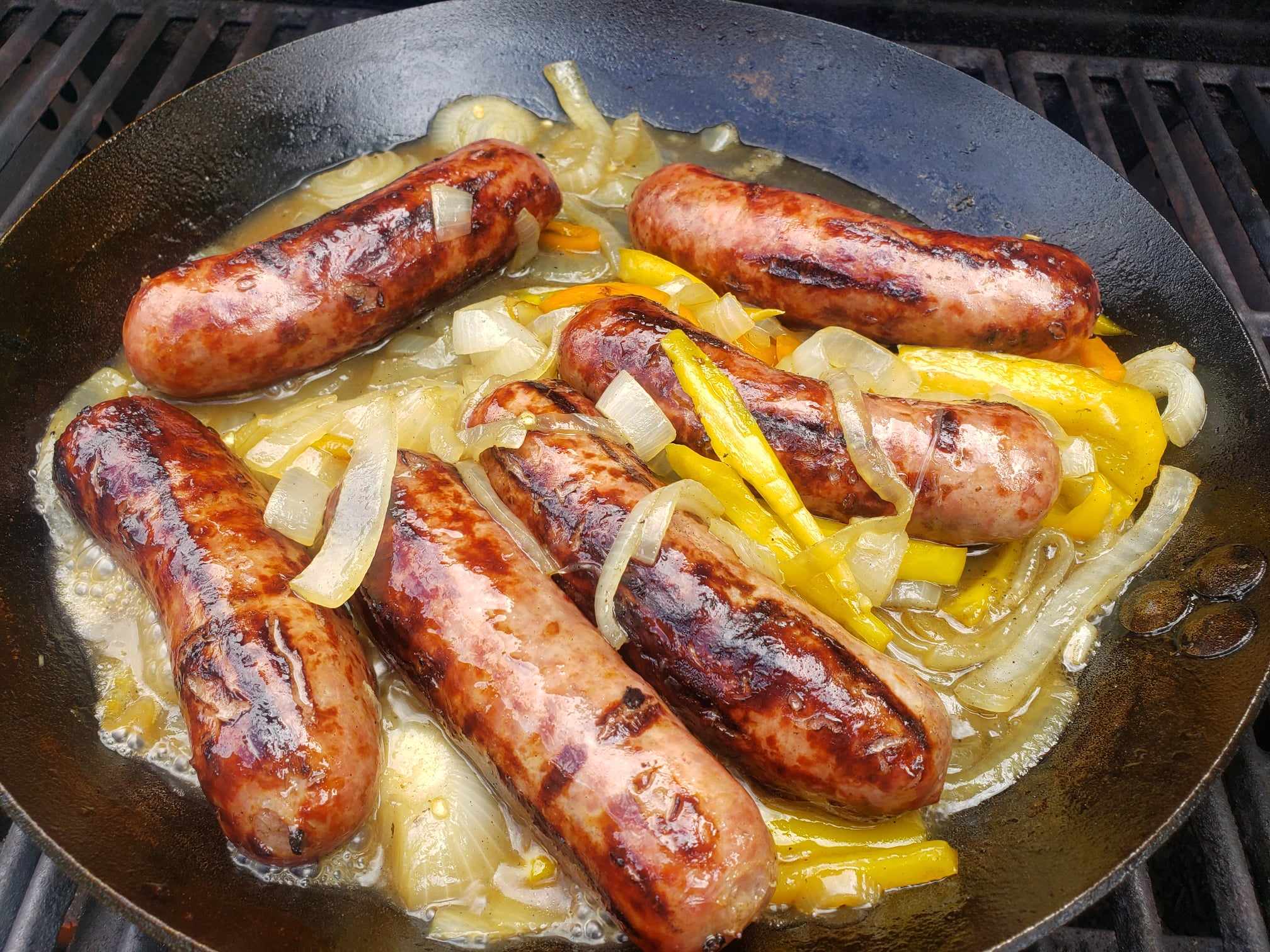 Grilled beer brats with onion and peppers