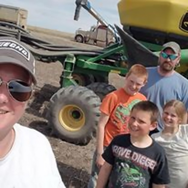 Heather and her family in the field