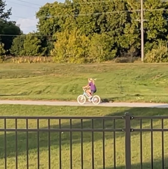 Like she has always been riding a bike!