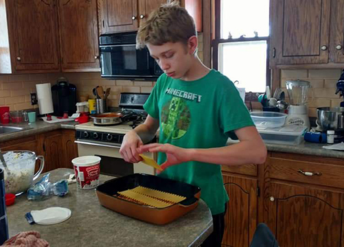 Nick makes lasagna for the family