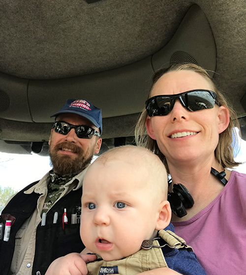 The Lovas family in the tractor cab