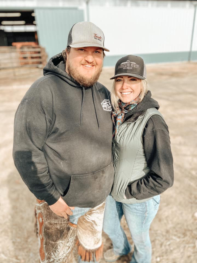 Blake and Whitney working cattle