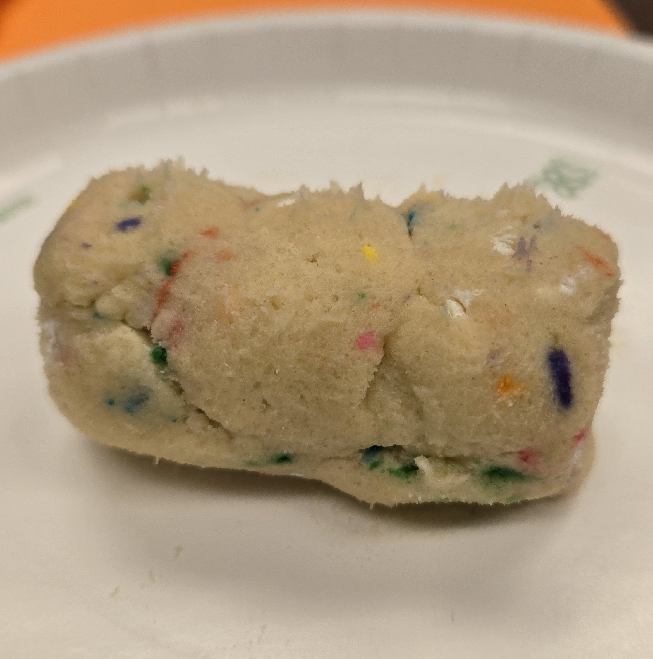 rolling out edible cookie dough into a "corn cob" 