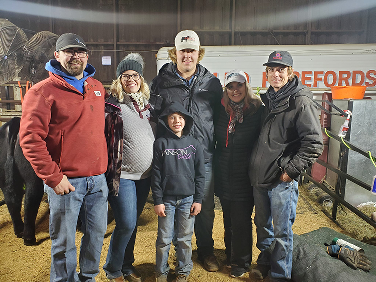 family members pose with JaCee and Levi