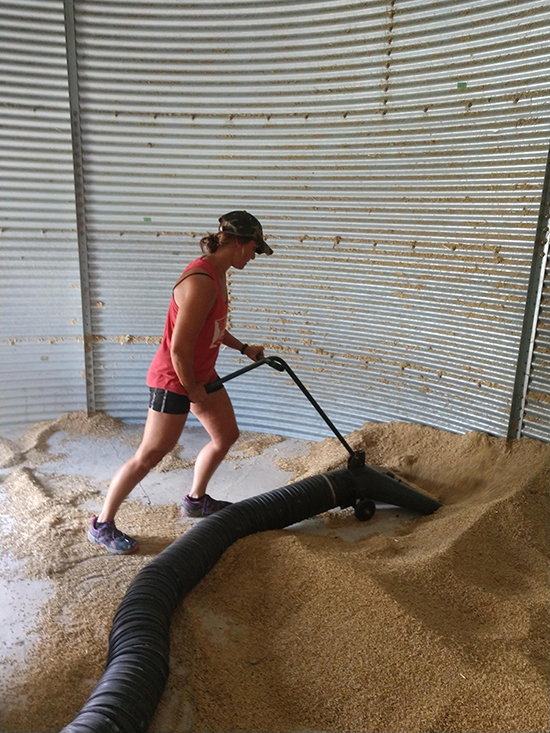 vacuuming grain out of the bin