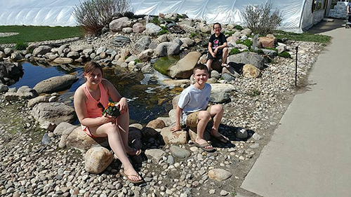 Moore kids visit the greenhouse