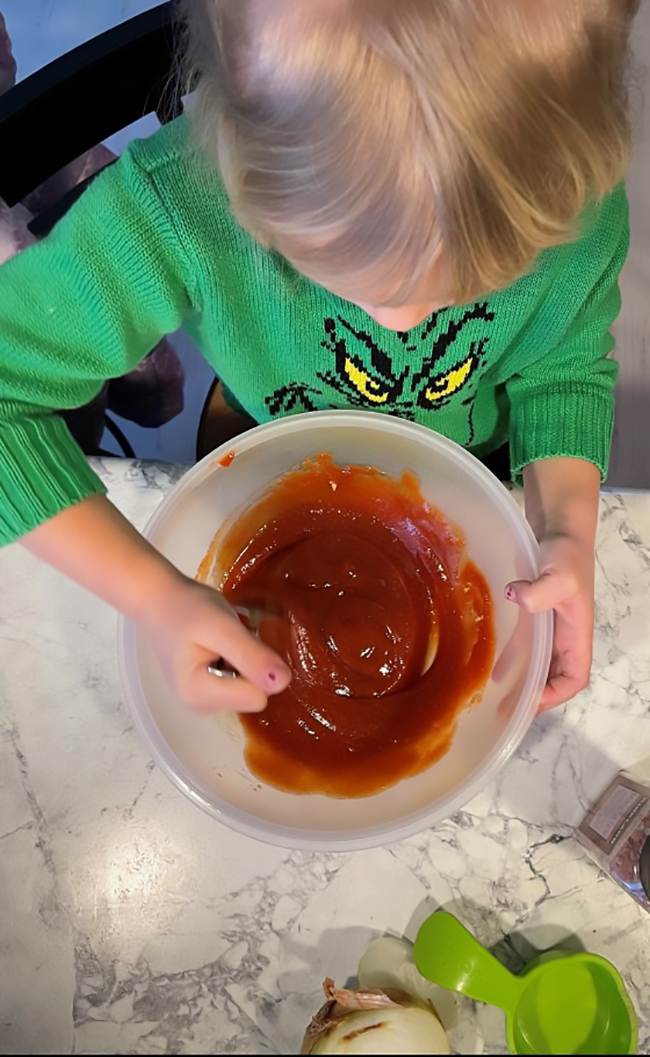 Miss A helps with the meatloaf prep