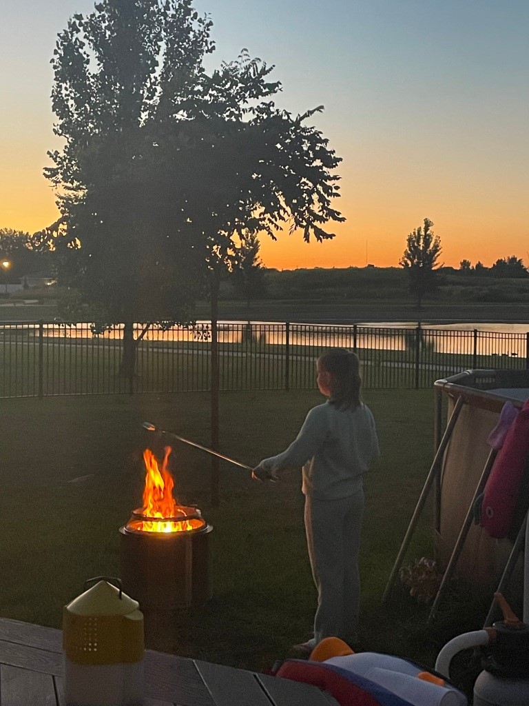 roasting marshmallows over a big flame